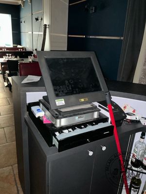 a laptop computer sitting on top of a table in a room