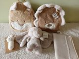 two stuffed animals sitting on the floor next to each other