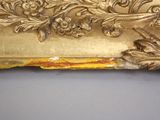 a picture of a gold frame with a bird on it