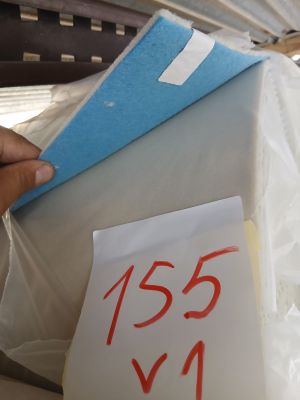 a person putting a piece of paper on top of a box