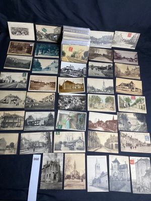 many old postcards of different types and sizes are on a table