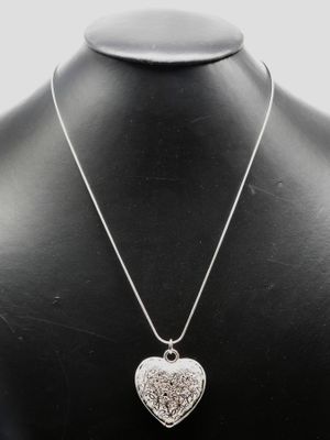a close up of a necklace on a mannequin mannequin