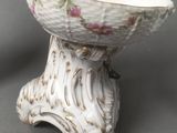 a statue of a horse in a bowl on a table