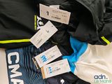 a lot of clothing that is sitting on a table