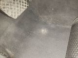 a close up of a car ' s floor with a car floor mat