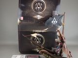 assassin origins collector ' s box with a statue of a man holding a spear and a sword