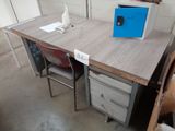 a desk with a microwave on top of it in a room