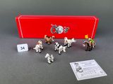toy figurines of different types of animals in front of a red box