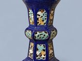 an image of a blue vase with flowers and birds on it