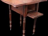 an old wooden table with a drawer underneath it on a black background