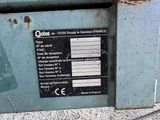 a label on the side of a machine that is sitting on the ground