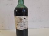 a bottle of wine that is sitting on a table