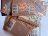 a pile of old envelopes with stamps on them