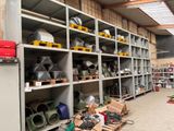 many shelves with different types of equipment in a warehouse