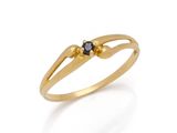 a close up of a gold ring with a black diamond