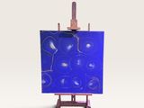 un petit chevalet sur lequel est posé un tableau bleu
