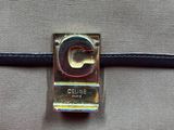 chanel logo on the front of a grey and purple bag