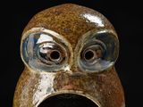 a ceramic owl that is sitting on a table