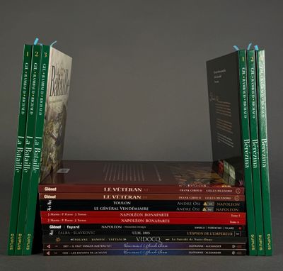 several books are stacked on top of each other on a table