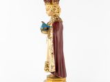 an image of a figurine of a man in a crown holding a book