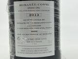 a bottle of wine sitting on a table with a label on it