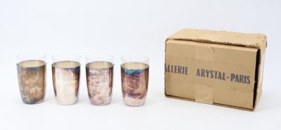 six shot glasses in a cardboard box with a box on the side