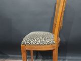 an image of a wooden chair with a leopard print upholstered seat