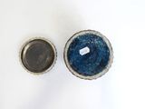two bowls that are sitting on a white surface
