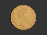 a gold coin with a profile of a woman ' s head
