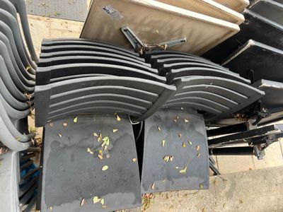 a lot of chairs that are sitting on the sidewalk