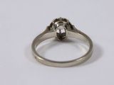 a close up of a ring on a white surface