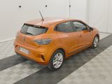the orange car is parked in the garage on the checkered floor