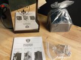 a coffee machine sitting on top of a table next to a bag of coffee