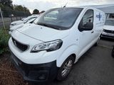 a white van that is parked in a parking lot