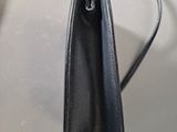 the inside of a black purse with a zipper open