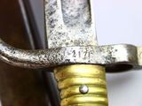 a close up of a metal object with a metal handle