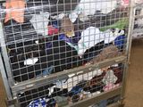 a metal cart with many items in it in a warehouse
