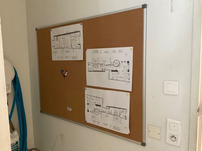 a picture of a cork board with drawings on it