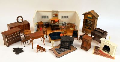 de nombreux meubles miniatures posés sur une surface blanche