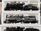 a train set in a plastic container on a table