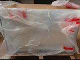 a large box with plastic wrap on it sitting on a pallet