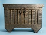 an old wooden chest with ornate carvings on it on a blue background