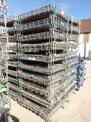 a large pile of cages stacked on top of each other
