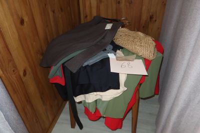 a pile of clothes sitting on top of a wooden table
