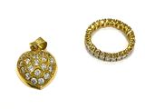 two pieces of gold and diamond jewelry on a white surface