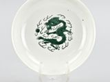 an image of a plate with a green dragon painted on it