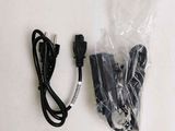 a picture of a cord and a charger on a table