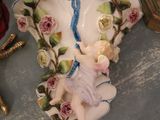a small figurine of a little girl sitting on a plate