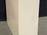 an image of a white refrigerator in a room