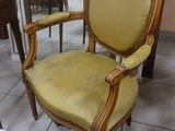 a yellow chair that is sitting in a room